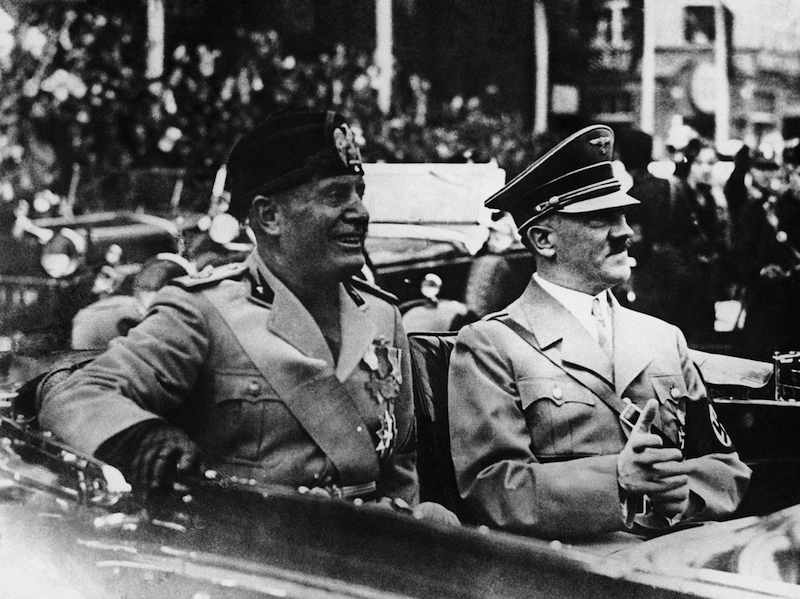 Mussolini and Hitler during their drive through Munich, Germany on Sept. 25, 1937. (AP Photo)